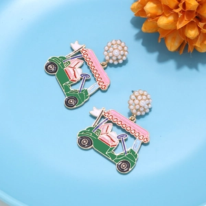Detail of golf cart earrings featuring pink roof, green body and pearl cluster studs