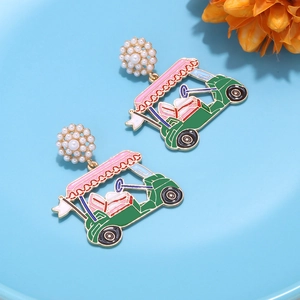 Detail view of golf car drop earrings with green enamel and faux pearl cluster studs