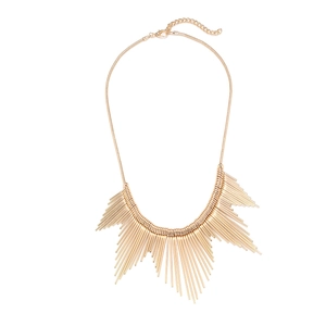 Statement gold fringe necklace with radial metal lines on a flat lay snake chain
