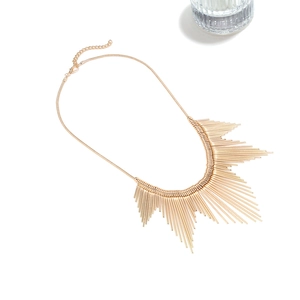 Chic gold layered metallic line tassel necklace featuring a radiant sunburst pendant design