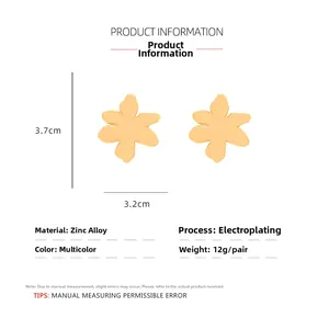Detail view of 3.7cm x 3.2cm gold floral earrings with dimensions and material specs
