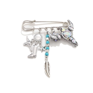 Western cowboy style brooch with silver boots, bull skull and turquoise feather charms