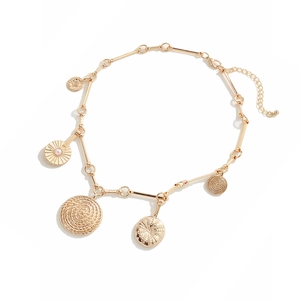Golden sun coin pendant necklace with multi-element charms and pearl detail on white background