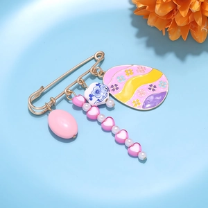 Easter egg and floral heart pin brooch in gold finish with colorful enamel pendants