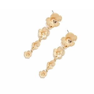 Elegant gold layered floral tassel earrings with four textured metal blossoms in a drop style