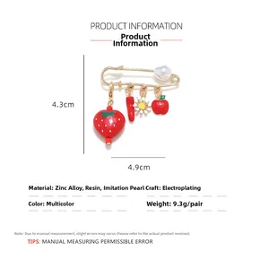 Detail showing dimensions 4.9x4.3cm for strawberry and pepper enamel brooch pin