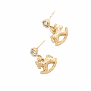 Close-up of golden rocking horse earrings with sparkling rhinestone detail and hammered texture