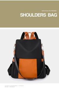 Detail of contrast-color nylon and faux leather backpack with anti-theft zipper design