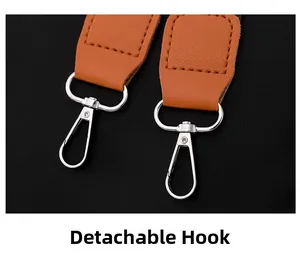 Detail of the detachable silver lobster clasp with brown pebble leather strap connector