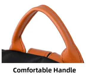 Macro shot of the contrast color leather handle and durable nylon stitching on bag