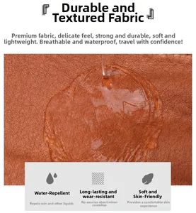 Waterproof detail of brown pebble grain leather sling bag showing water resistance