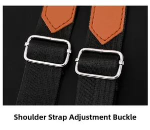 Close-up of adjustable nylon shoulder strap with silver buckle and brown leather patch