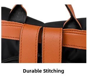Detailed macro view showing the precise double-row stitching on the black nylon backpack strap