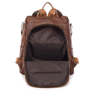 Brown PU leather backpack with large main compartment and internal pockets for storage