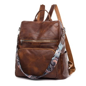 Dark brown retro PU leather backpack with vintage ethnic strap and multi-pocket design