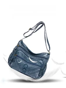 Close-up of lightweight vintage indigo blue PU leather crossbody bag with multi-pocket design