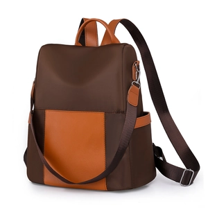 Women's two-tone nylon backpack in coffee and orange with adjustable straps and top handle