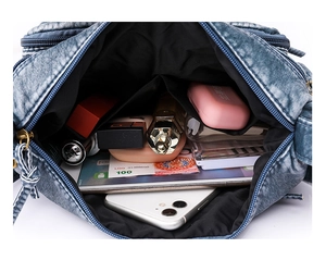 Detailed interior of vintage washed leather crossbody bag showing large storage capacity