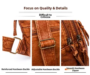 Detail of vintage brown washed leather bag showing bronze hardware and dual zippers