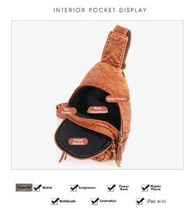 Interior pocket display of brown PU leather crossbody bag showing large storage capacity