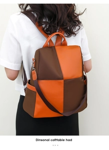 Detail of high-density nylon contrast color backpack with adjustable straps and side pocket