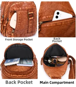 Detail view of the multi-layer storage compartments in a brown PU leather chest bag