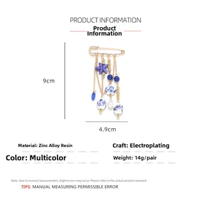 Detailed size chart of a ceramic starfish brooch with blue tassels and printed beads