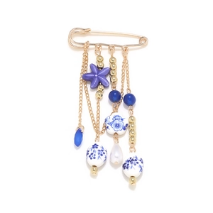 Starfish ceramic bead tassel brooch with blue floral print and gold metal accents