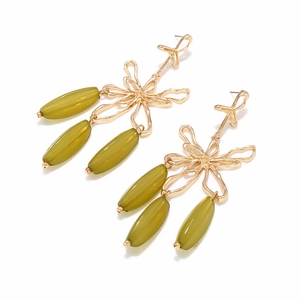 Detailed view of vintage gold hollow floral earrings with olive green translucent beads