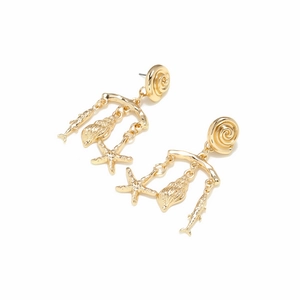 Detail of gold tropical ocean earrings with starfish shell and fish pendants