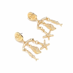 Detail of gold ocean-themed drop earrings with starfish, conch and fish pendants