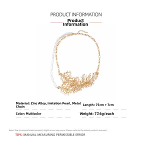 Detail view of gold coral-shaped alloy accents and white faux pearls on a tiered necklace