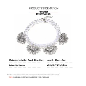 Detailed view of layered baroque pearl necklace with zinc alloy sunburst fan pendants