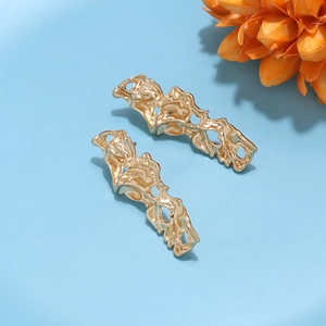 Modern gold lava texture earrings with minimalist organic shapes on a blue background