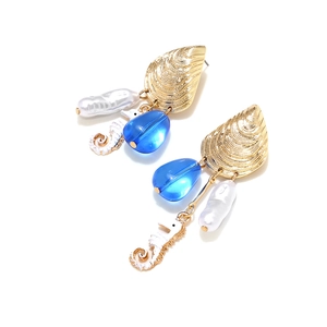 Asymmetric shell and seahorse earrings with baroque pearls and blue resin drops