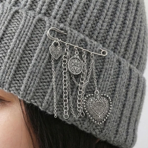 Vintage silver heart chain brooch with engraved lock and tassel on knitted hat