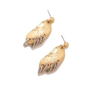 Detail of hammer-textured gold earrings with cascading silver chain links for women