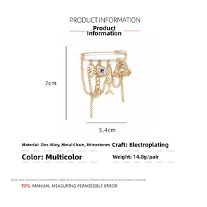Detailed size specifications for the golden crab and tropical fish brooch with blue rhinestones