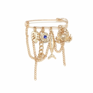 Gold ocean themed safety pin brooch with crab, fish, leaf charms and fringe tassels