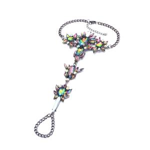 Bohemian slave bracelet with iridescent crystals and black gunmetal finish on white background