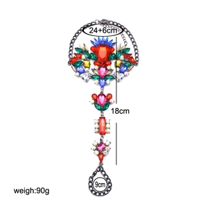 Detailed view of colorful rhinestones on a chunky gun black hand harness bracelet