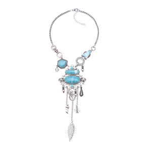 Bohemian silver tassel long necklace with blue turquoise and feather pendants on white background
