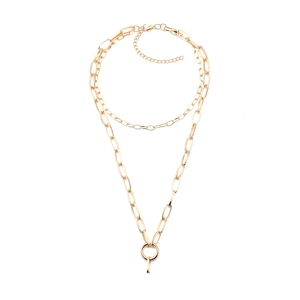 Detail view of gold-toned double-layered chain necklace with a circular pendant
