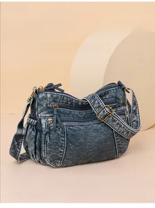 Blaue Denim-Umhängetasche mit mehreren Reißverschlüssen und verstellbaren Trägern