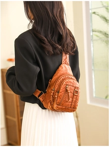 Detailed view of vintage brown PU leather crossbody chest bag with multi-pocket design