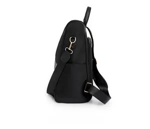 Vista laterale dello zaino oxford nero impermeabile con ganci metallici e zip dorate