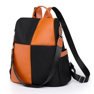 Contrast nylon and orange leather fashion backpack with large capacity and side pockets