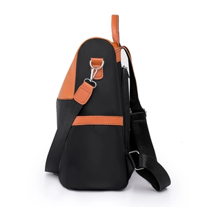 Contrast color black and orange women's backpack with large capacity and side zipper