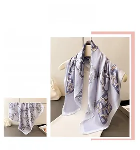 Detailed close-up of lavender silk scarf featuring elegant chain patterns and soft texture