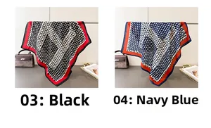 Detail of geometric triangle pattern silk scarves in black and navy blue color combinations